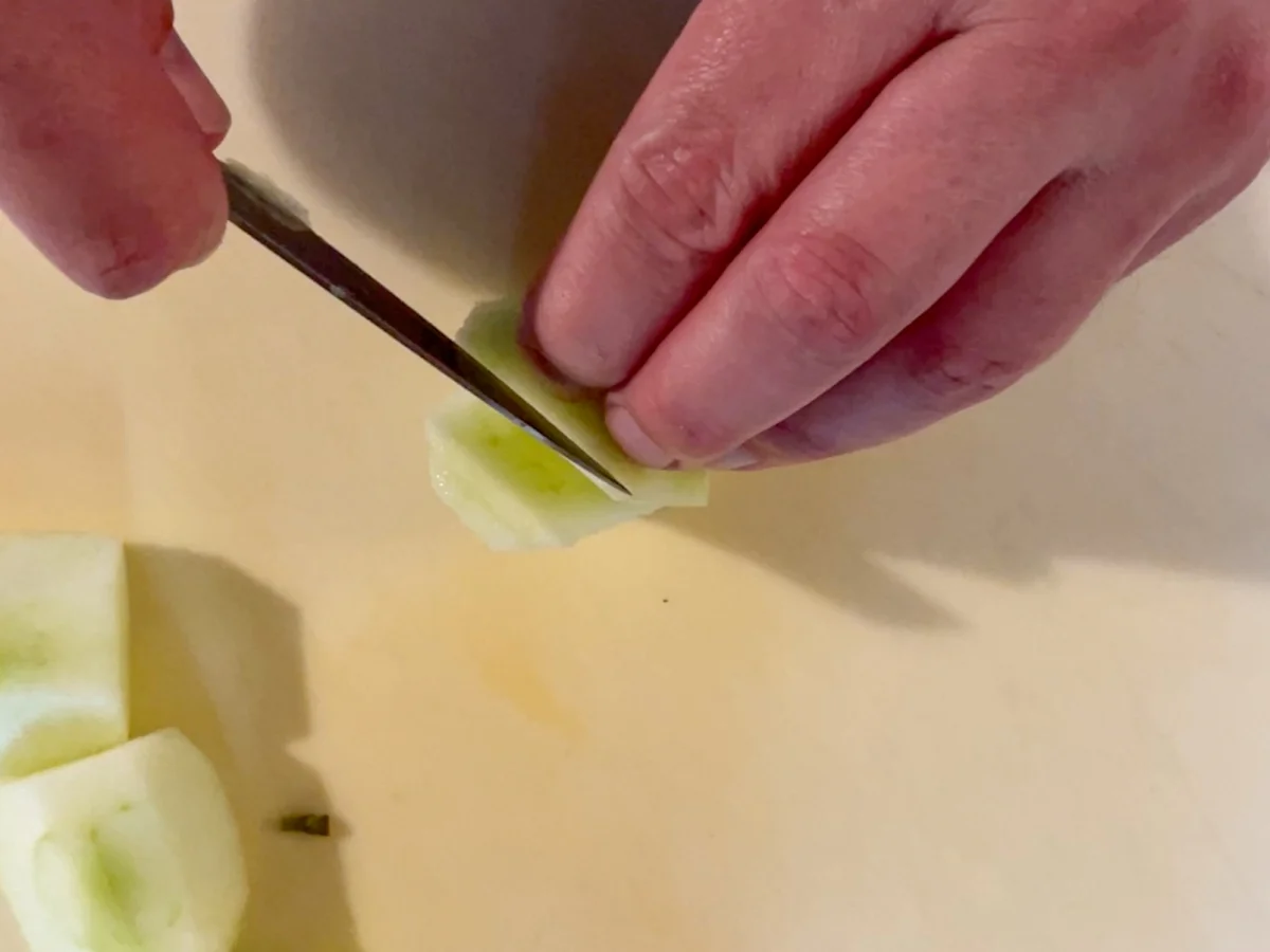 Cutting an apple into thin slices lengthways