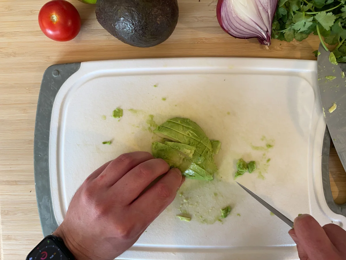 Cutting avocado into chunks