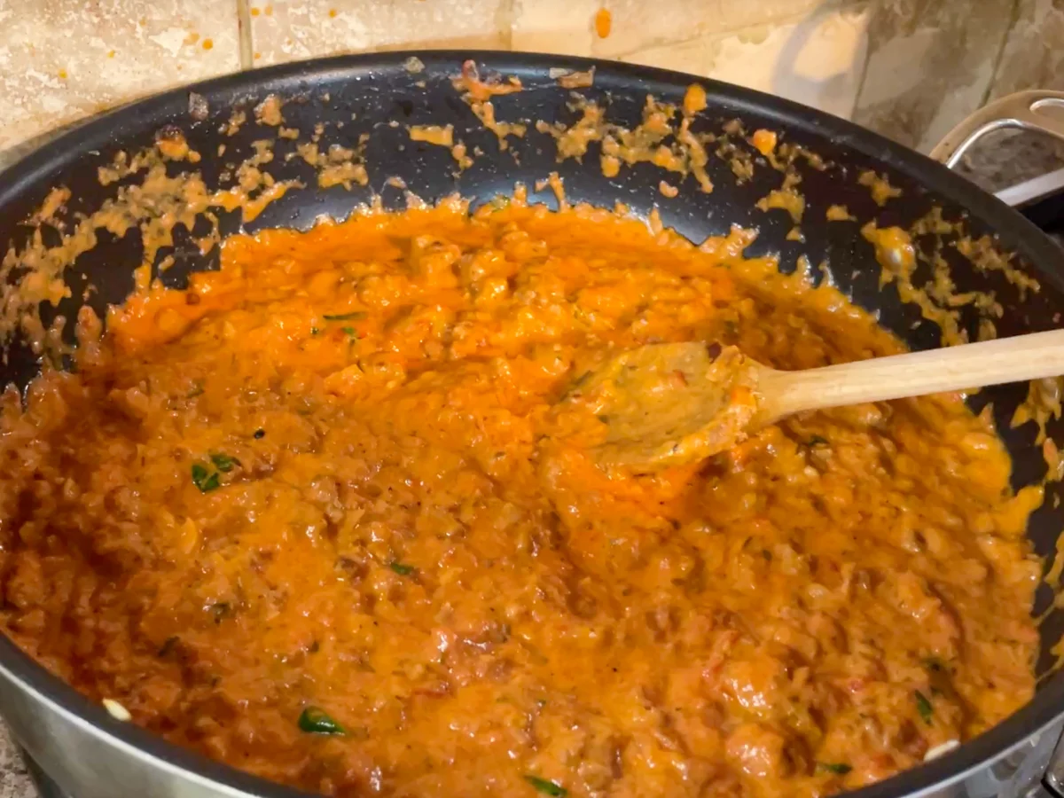 Mascarpone added to the sausage, tomato ragu