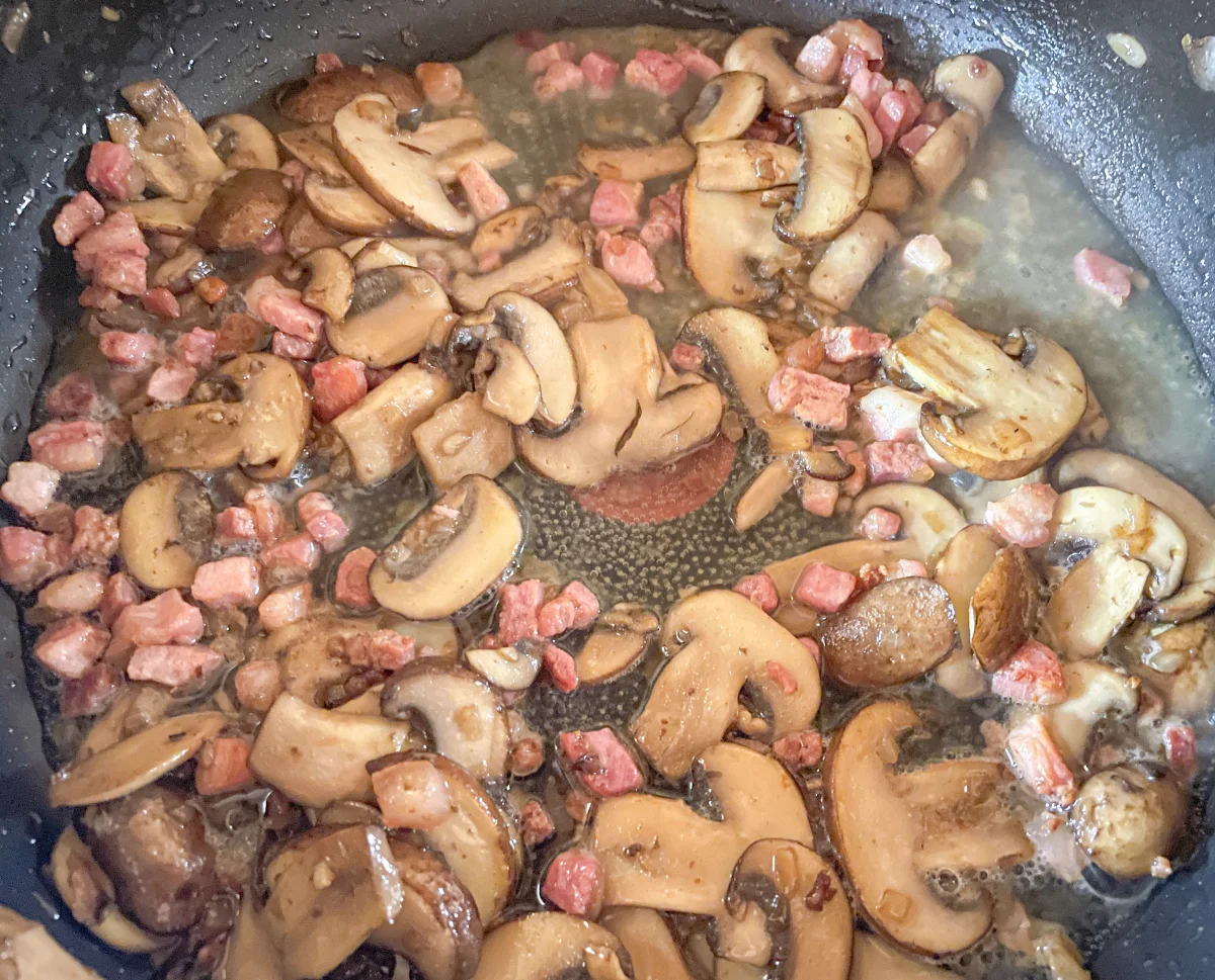 Pancetta returned to pan with white wine