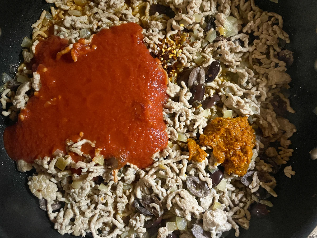 Passata, red pesto and chilli added to the pork mixture