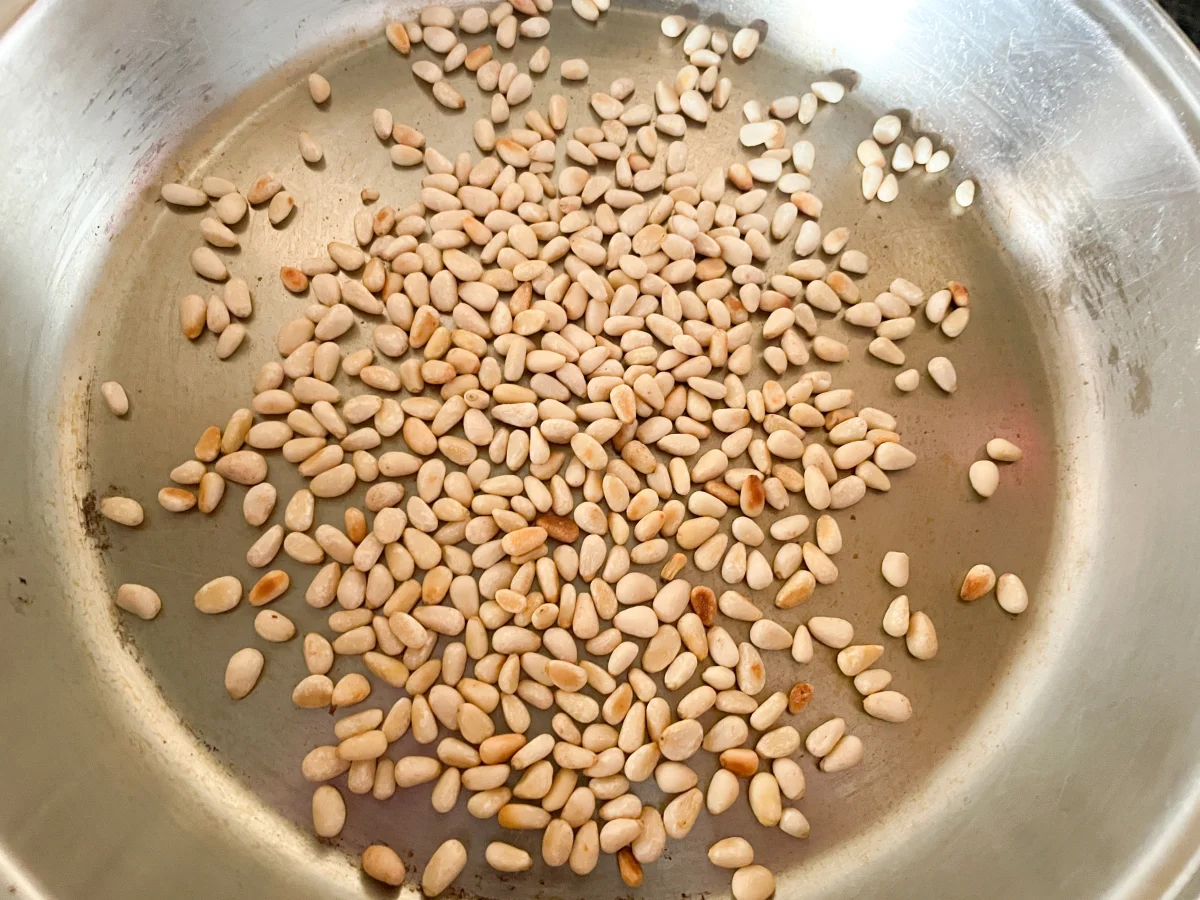 Pine nuts being dry roasted