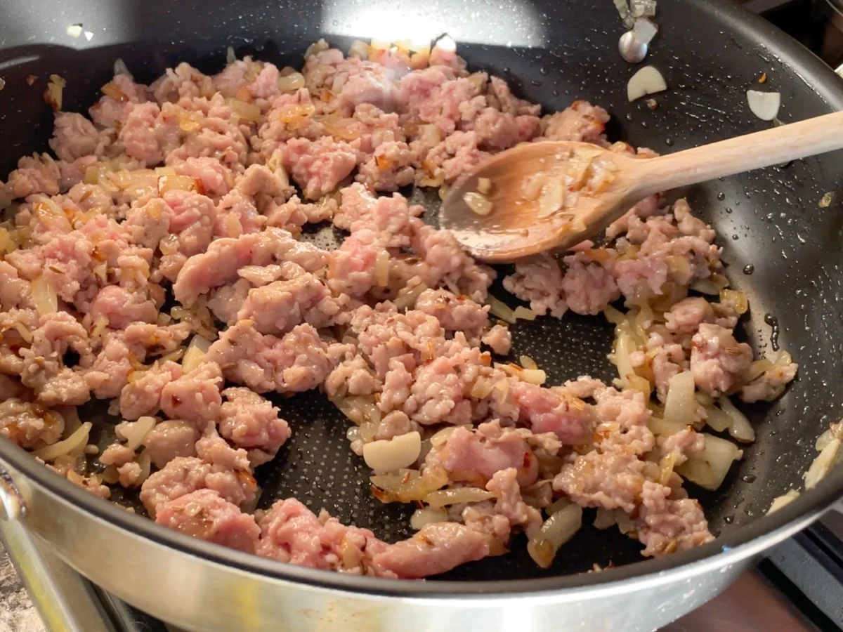 Sausage meat added to the pan