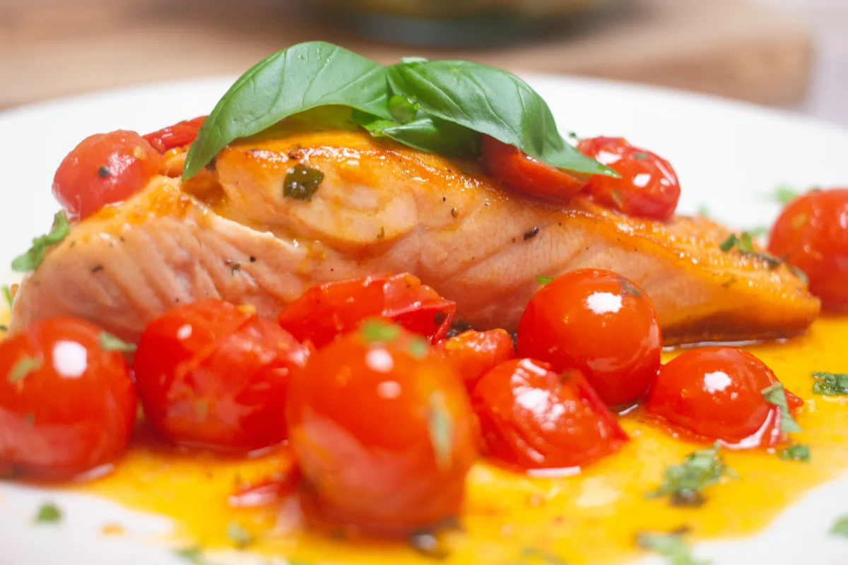 Side view of Pan-fried Salmon in a Cherry Tomato and Basil Sauce