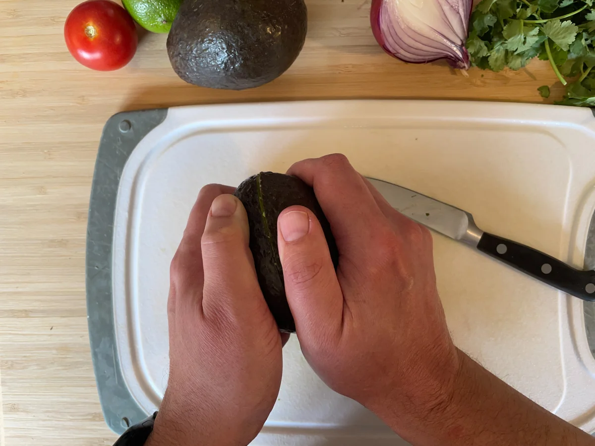 Twisting avocado halves